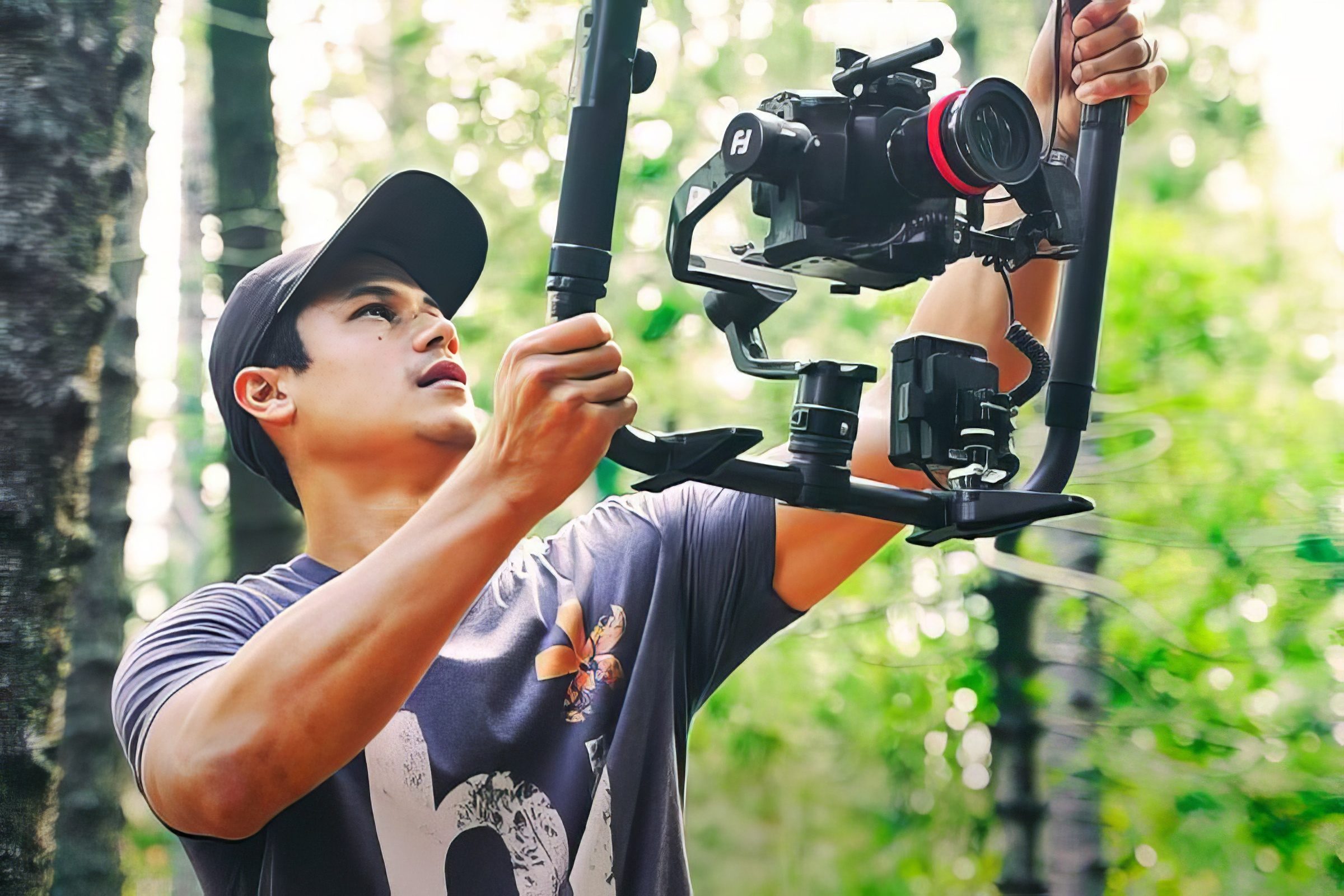 Kawika Lopez operating a gimbal mounted cinema camera on location