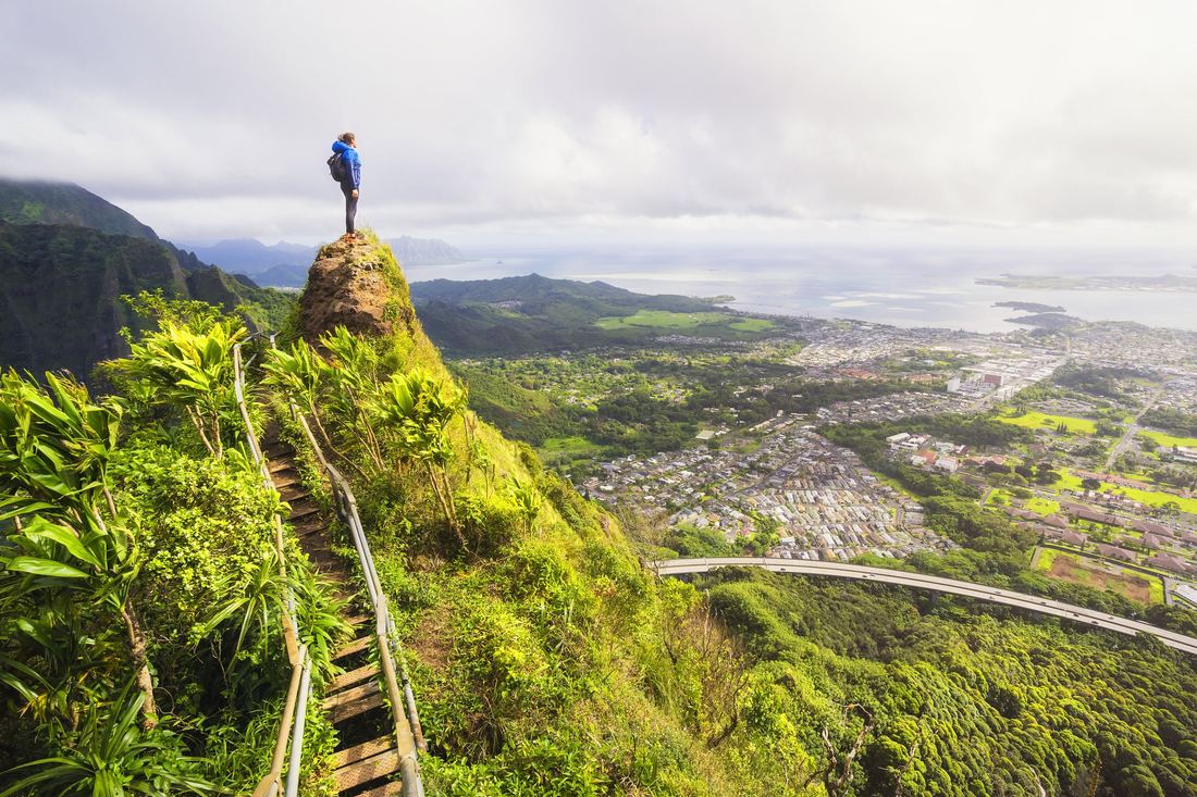 A hiker on a ridge high above Kaneohe