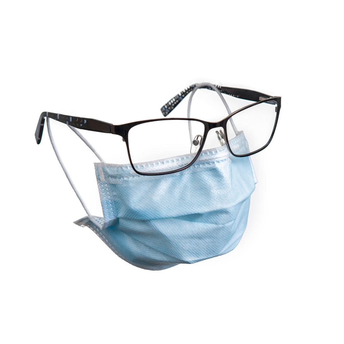 Eyeglasses resting on a surgical mask, a product shot