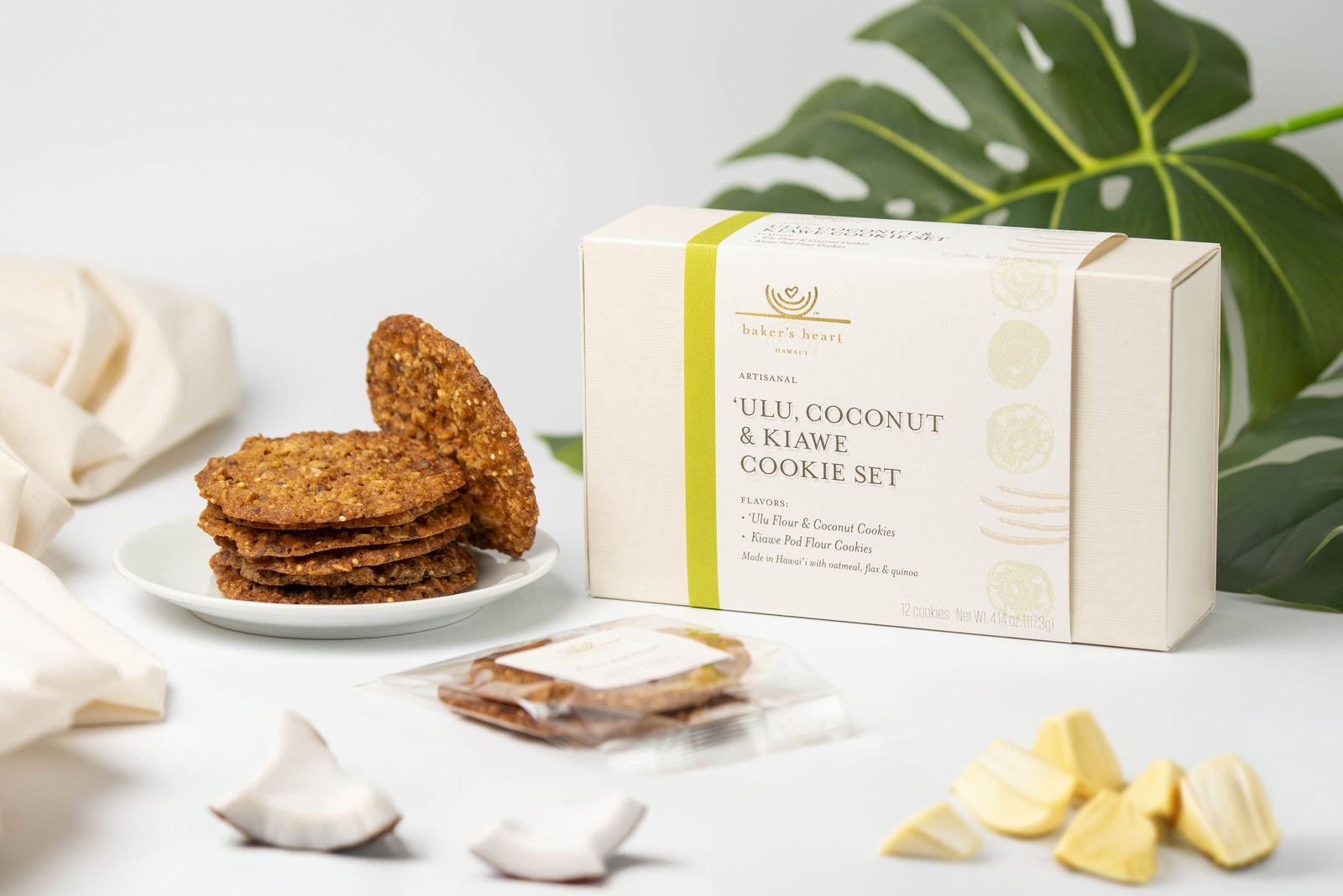 A Touch A Heart coconut and kukui cookie set with cookies arranged around it