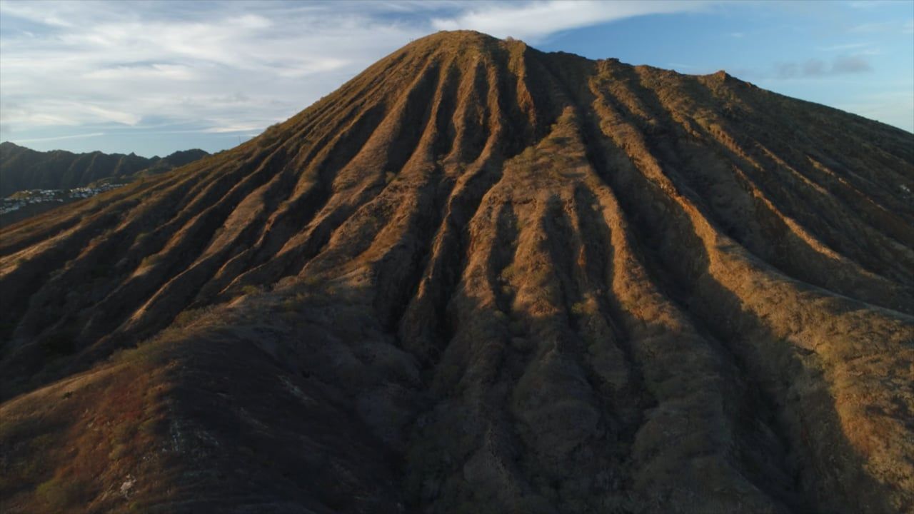 Aerial of a Hawaii ridge at golden hour, from the Touch A Heart awareness film