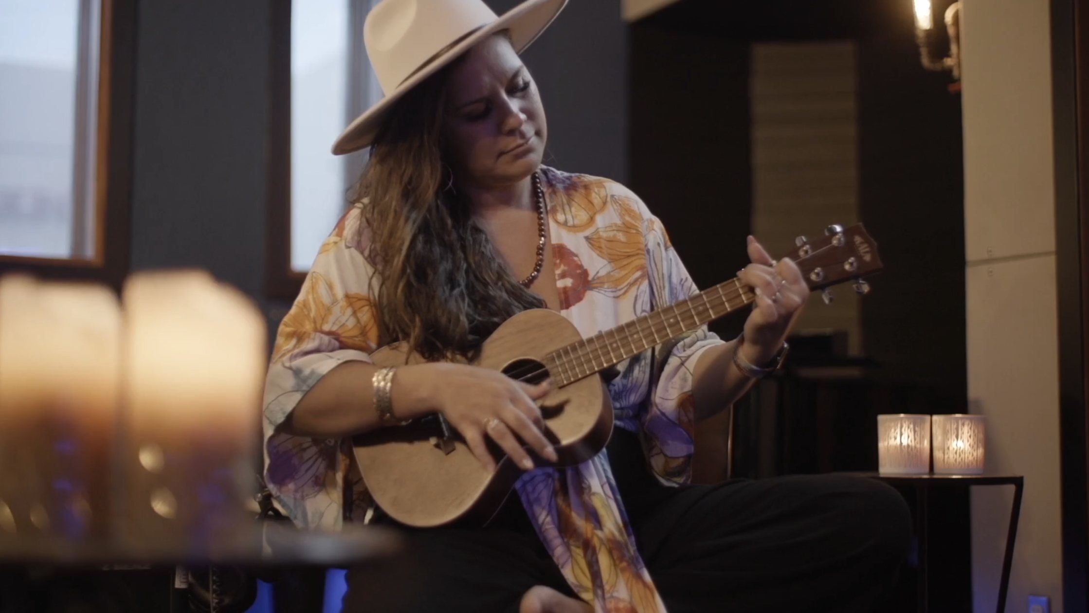 Kimie Miner playing ukulele during a documentary shoot